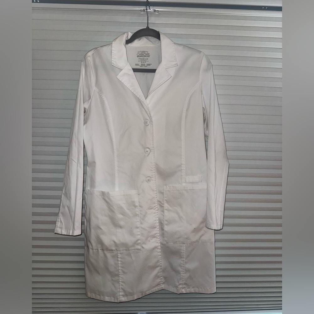 Woman’s white lab coat